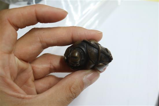 Four Japanese netsuke: one bronze, a cockerel, a dragon and figure on a gourd